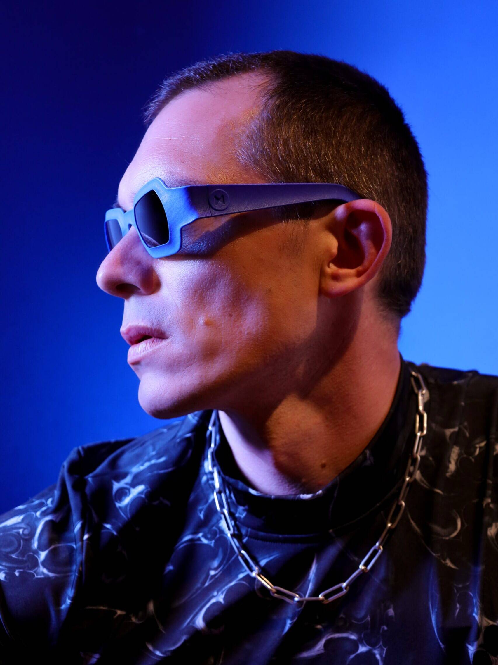 Side portrait showing REFRAMD Afronaut computationally designed sunglasses and sculpted temple geometry