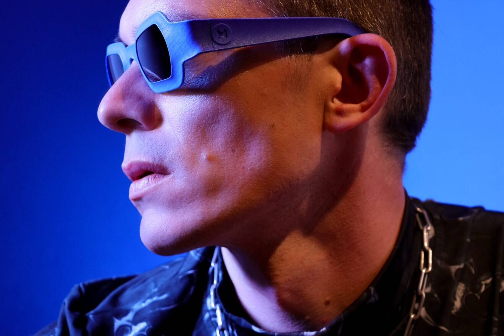 Side portrait showing REFRAMD Afronaut computationally designed sunglasses and sculpted temple geometry